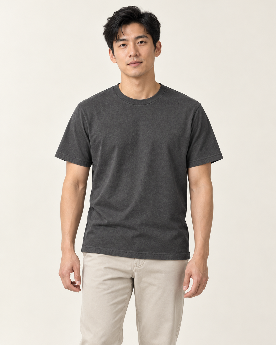 Adult man wearing the COMMON FORM Men's Core Crew Tee in Charcoal.