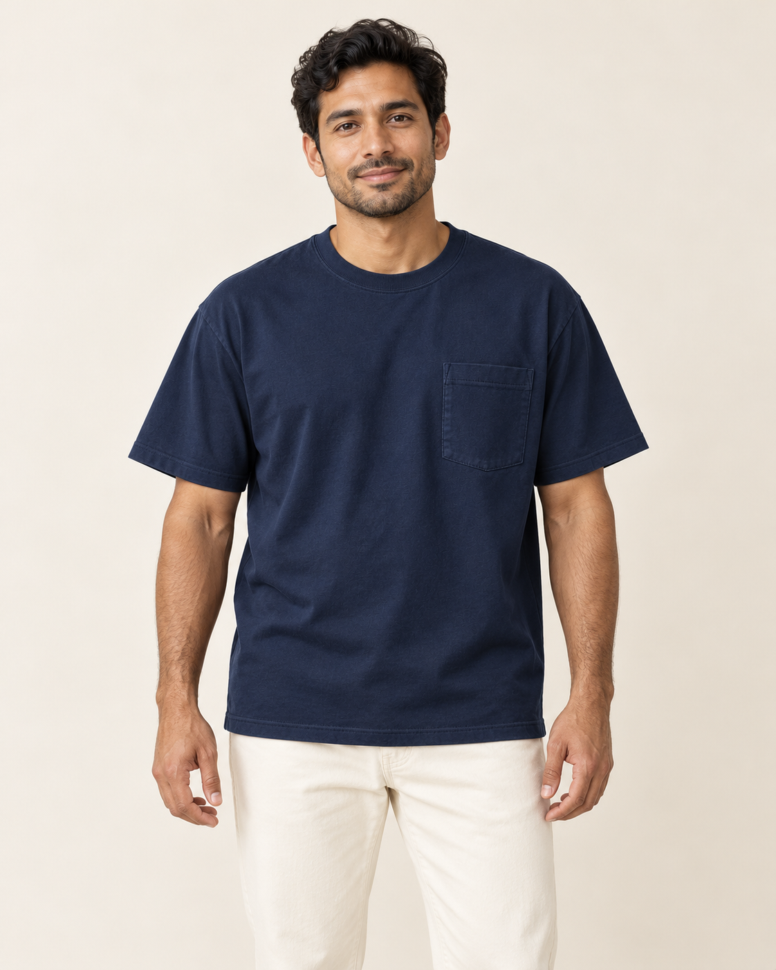 Adult man wearing the COMMON FORM Men's Relaxed Pocket Tee in Navy.
