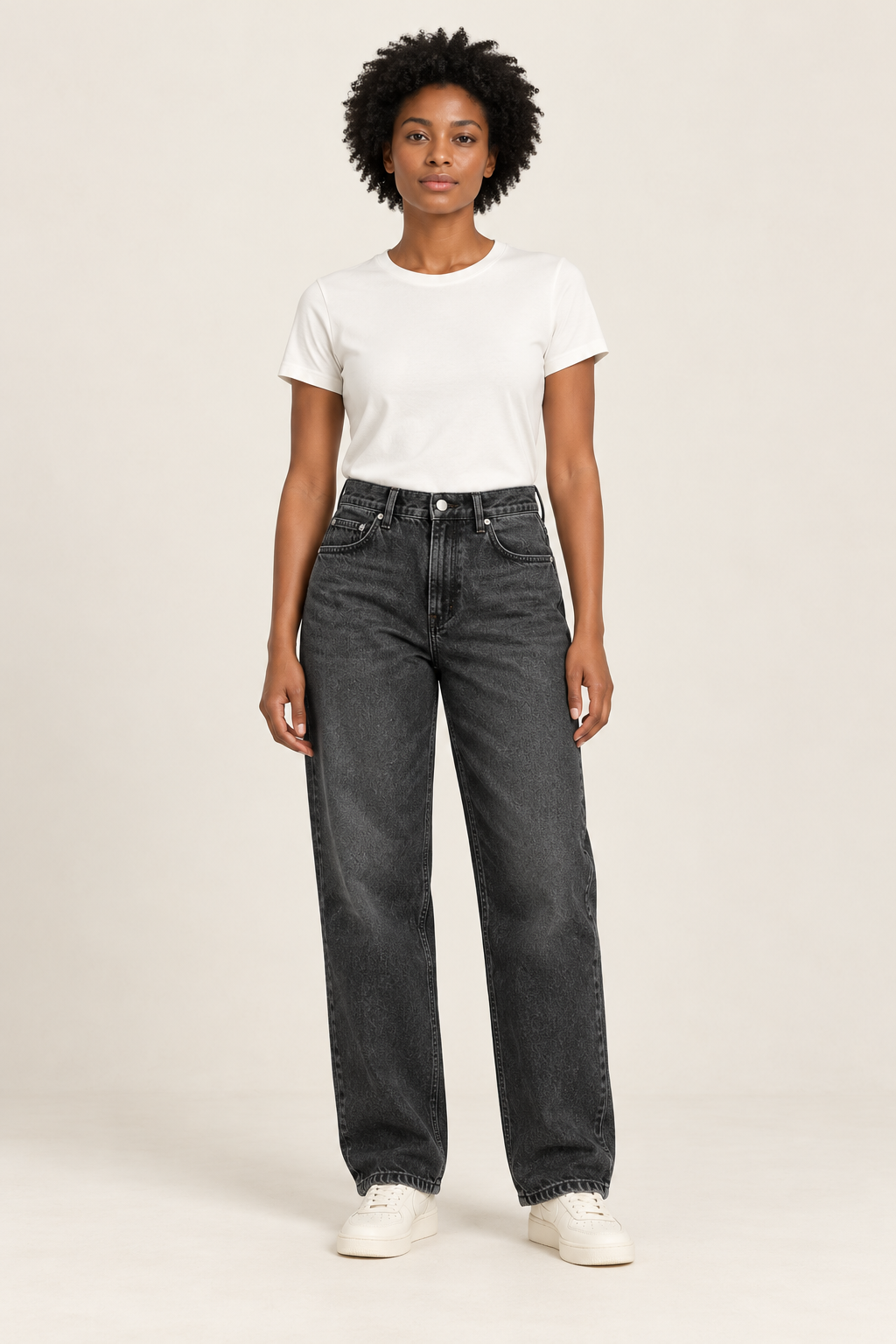 Adult woman wearing the COMMON FORM Women's Relaxed Jean in Washed Black.